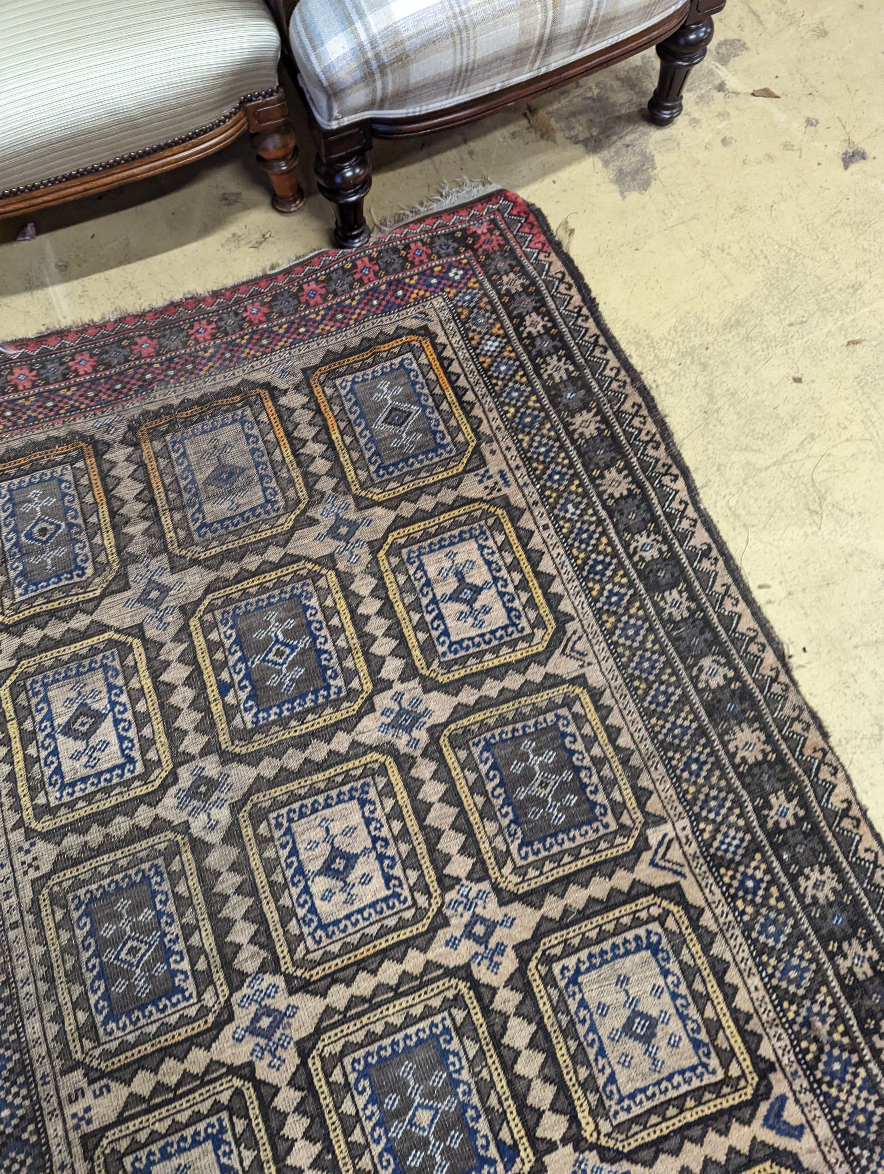 A Belouch geometric rug, 216 x 130cm. together with four Kelim cushion covers